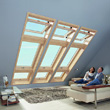 Ciepłe okna dachowe drewniane Roto R4 połączone pionowo z oknami RotoTronic